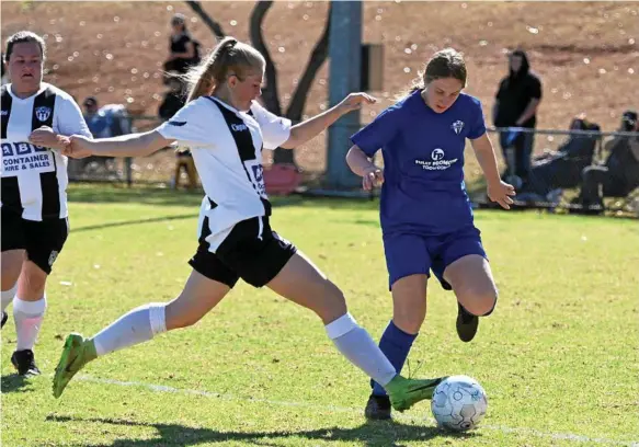  ?? Photo: Bev Lacey ?? FINAL FOES: Willowburn’s Courtney Morris (left) challenges Rockville’s Melony Baker during a match between the two sides earlier this season. The two teams will face off in this Sunday’s Toowoomba Football League Premier Women’s grand final at Clive Berghofer Stadium.