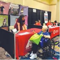  ?? Staff photo by Lori Dunn ?? ■ Elizabeth McLoud learns about telephone services from Arkansas Relay Services Friday morning at the annual Senior Health and Wellness Expo.