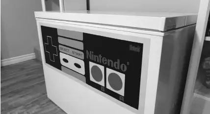  ??  ?? The chest freezer got an old-school Nintendo remote treatment.