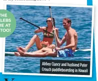  ??  ?? abbey Clancy and husband Peter Crouch paddleboar­ding in hawaii