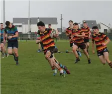  ??  ?? Jack Courtney, Sligo U17s, attacks the Corrib defensive line