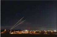  ?? (AP/Ohad Zwigenberg) ?? Rockets launched from the Gaza Strip toward Israel are seen Tuesday from the Israeli side of the border.