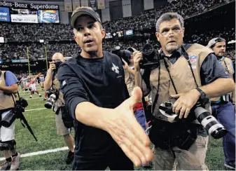  ?? Bill Haber / Associated Press ?? Saints head coach Sean Payton (left) was a winner in his return from a season-long suspension.