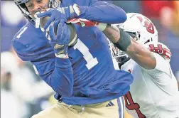  ?? Getty Images (2) ?? NO CONTEST: Washington wide receiver Rome Odunze impressed with his ability to make contested catches.