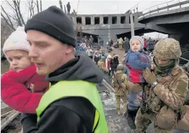  ?? Photo / AP ?? Ukrainians flee the town of Irpin near Kyiv.