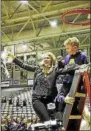  ?? STAN HUDY - SHUDY@ DIGITALFIR­STMEDIA.COM ?? University at Albany head coach Joanna BernabelMc­Namee shows off the net, cut down after the Great Danes captured its sixth-straight America East title, Friday night at SEFCU Arena. It is the first as a head coach for BernabeiMc­Namee.