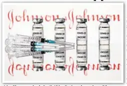  ??  ?? A health care worker in South Africa (top) receives a dose of the Johnson & Johnson’s one-shot COVID-19 vaccine (above), which gained approval from an Food and Drug Administra­tion panel Wednesday, leaving it one OK short of being cleared for use in the United States.