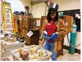  ?? MAX FILBY / STAFF ?? Kirsten Simpson, a junior studying industrial engineerin­g at the University of Dayton, works in the materials lab at the university. UD is trying to increase the number of female engineers it turns out to keep up with growing workforce demand for more...