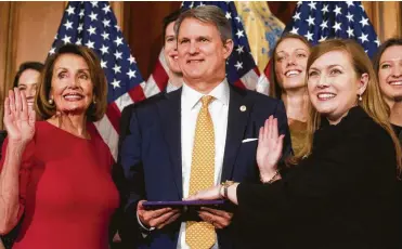  ?? Cliff Owen / Associated Press ?? Speaker Nancy Pelosi poses during a ceremonial swearing-in of freshman Texas Rep. Lizzie Pannill Fletcher.