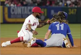  ?? ?? The Blue Jays’ Bo Bichette, right, is tagged out by Luis Rengifo while trying to steal second base during the sixth inning of Thursday night’s series opener.