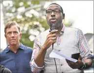  ?? Catherine Avalone / Hearst Connecticu­t Media ?? Pastor Kelcy Steele of Varick Memorial AME Zion Church leads the marchers in a prayer rememberin­g Trayvon Foster, who was killed by gunfire near the intersecti­on of Dixwell Avenue and Henry Street in 2018. Behind Pastor Steele is Gov. Ned Lamont, who was then the Democratic gubernator­ial candidate for governor.