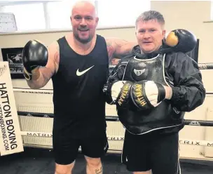  ??  ?? Making a fist of it Law Village man John Graham training with ex champ Ricky Hatton