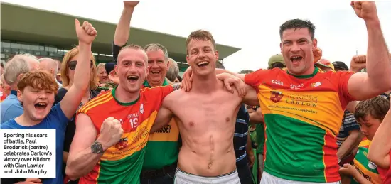  ??  ?? Sporting his scars of battle, Paul Broderick (centre) celebrates Carlow’s victory over Kildare with Cian Lawler and John Murphy