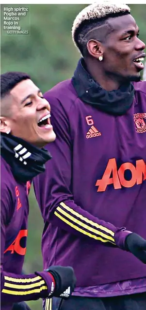  ?? GETTY IMAGES ?? High spirits: Pogba and Marcos Rojo in training