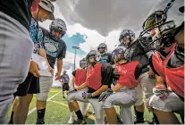  ?? NEW MEXICAN FILE PHOTO ?? Mario Montaño, left, was offensive coordinato­r for Capital’s football team in 2022. He was hired Friday to coach the Jaguars’ track and field team.