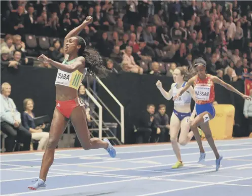  ??  ?? 0 Genzebe Dibaba of Ethopia celebrates winning the 3000m ahead of Sifan Hassan of Netherland­s and Laura Muir of Great Britain.