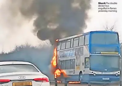  ?? ?? Shock The double decker bus engulfed in flames yesterday morning