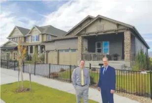  ??  ?? KB Home’s Tom Magnetti, left, and Tyler Harris show off a ranch model from KB Home’s Estates Collection at Somerset Meadows. Above right, a Reserve Collection ranch model.