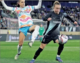  ?? Getty Images ?? GO FOR TWO: Gotham FC’s Emily Sonnett is chased by San Diego’s Alex Morgan during a 1-0 loss last week in the Challenge Cup. Gotham, the defending NWSL champs, officially begin their title defense Sunday against Portland.