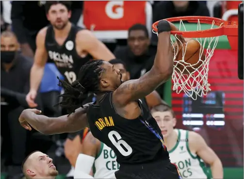  ?? MICHAEL DWYER — THE ASSOCIATED PRESS ?? Brooklyn Nets’ DeAndre Jordan (6) dunks during the first half of an NBA basketball game against the Boston Celtics, Friday, Dec. 25, 2020, in Boston.