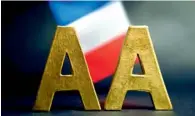  ?? — AFP ?? Standard & Poor’s downgraded France’s credit rating by one notch to AA, with outlook stable.
