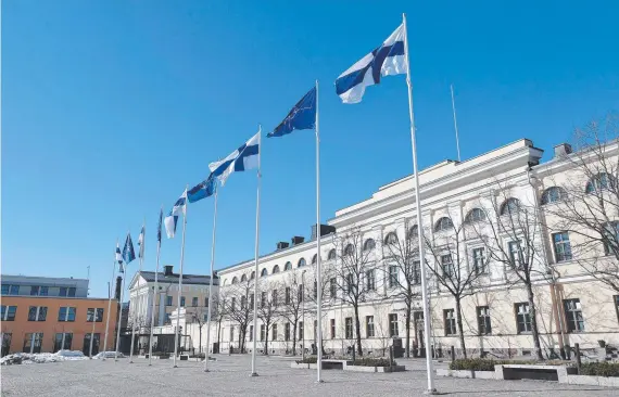  ?? ?? Finnish and NATO flags flutter at the courtyard of the Foreign Ministry in Helsinki, Finland ahead of the country’s historic admittance into NATO. Picture: AFP