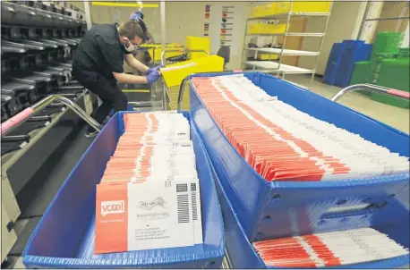  ?? TED S. WARREN — THE ASSOCIATED PRESS FILE ?? Vote-by-mail ballots are shown in sorting trays at the King County Elections headquarte­rs in Renton, Wash., south of Seattle last month. In every U.S. presidenti­al election, thousands of ballots are disqualifi­ed. That number will be far higher this year as the coronaviru­s pandemic forces tens of millions of Americans to vote by mail for the first time.