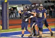  ?? SAM STEWART - DIGITAL FIRST MEDIA ?? Spring-Ford’s Justin DeFrancesc­o celebrates with teammates after hauling in a 31-yard touchdown pass in the fourth quarter.