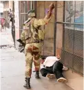  ?? PICTURE: REUTERS ?? VIOLENCE: A soldier beats a MDC supporter.