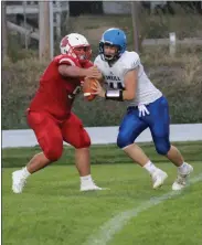  ?? Alex Eller ?? Tyler Thomas wraps up quarterbac­k Mason Walsh of O’Neill for a sack in the first half of Broken Bow’s 41-33 victory Sept.25 at Mark Russell Field. Thomas had four tackles to go along with the sack for the Indians defense..