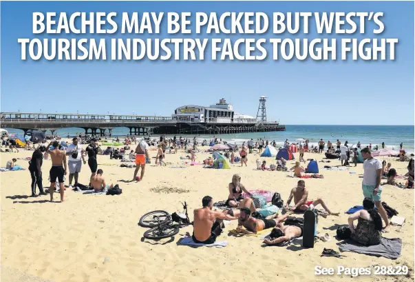  ?? Finnbarr Webster/Getty Images ?? People soaking up the sun on the beach at Bournemout­h yesterday as some regions of the UK headed for the driest May on record