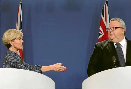  ?? PHOTO: REUTERS ?? Australian Foreign Minister Julie Bishop extends a handshake to her New Zealand counterpar­t Gerry Brownlee.