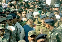  ?? — PTI ?? RJD chief and former chief minister of Bihar Lalu Prasad Yadav is produced at the special CBI court in Ranchi on Wednesday to receive his quantum of sentence in a fodder scam case.