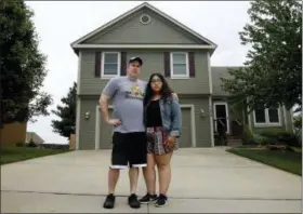  ?? CHARLIE RIEDEL — THE ASSOCIATED PRESS ?? In this May 24, 2018 photo, Jennifer Tadeo-Uscanga, 17, and her stepdad, Steve Stegall, stand outside the Kansas City, Mo., home they shared with wife and mother Letty Stegall. Stegall, who lived in the United States for 20 years, was deported back to Mexico in March, leaving the pair to fill the void left by her absence.