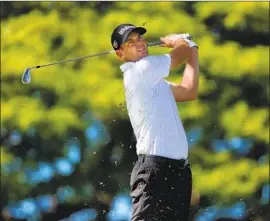  ?? Gregory Shamus Getty Images ?? BRENDAN STEELE PLAYS an iron off the tee on the par-four second hole at Waialae Country Club. Steele made nine birdies and no bogeys.