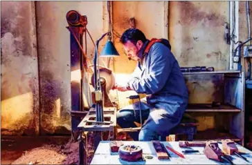  ?? AFP ?? Bouchnak, 37, took over the family business started by his grandfathe­r and is the only craftsman in Tunisia and one of a few in the region - to continue to make pipes by hand.