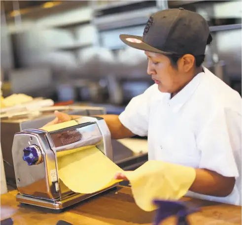  ?? Scott Strazzante / The Chronicle ?? Lydia Juarez makes agnolotti pasta at A Mano in S.F. The restaurant uses three pasta makers from Emilio Mitidieri’s import business.