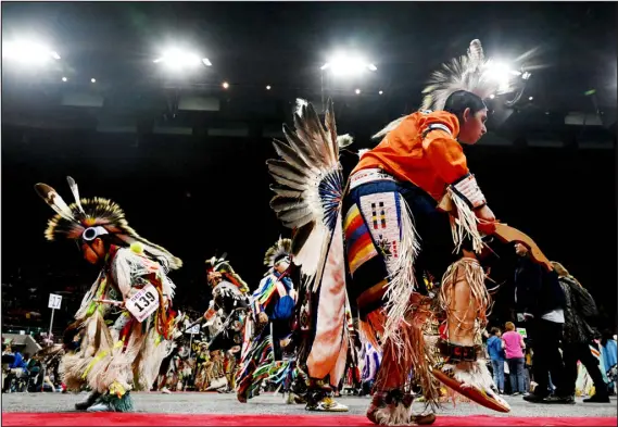  ?? PHOTOS BY HELEN H. RICHARDSON — THE DENVER POST ?? Young dancers participat­e during one of the many dances at the Denver March Powwow at the Denver Coliseum.