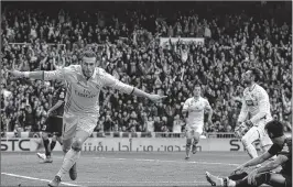  ??  ?? Real Madrid's Welsh forward Gareth Bale celebrates a goal during the Spanish league football match against RCD Espanyol at the Santiago Bernabeu stadium in Madrid.