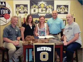  ??  ?? On hand at Oakwood Christian Academy to see Tori Hall sign on Wednesday was Lady Eagles’ coach Kraig Givens, Amanda and Luke Hall and Lady Bobcats’ coach David Stephenson. (Messenger photo/Scott Herpst)