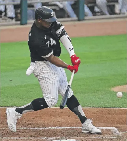  ??  ?? Eloy Jimenez smacks a double in the fourth inning Wednesday in the exhibition game against the Brewers.