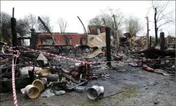  ??  ?? The family home and antiques business destroyed in the Wellington­bridge fire.