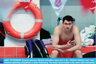  ?? — AFP ?? SAINT PETERSBURG: Russian swimmer Kliment Kolesnikov takes part in the “Vladimir Salnikov Cup” internatio­nal swimming competitio­n in Saint Petersburg. The world record holder in the men’s 50m backstroke has vowed to sit out the Paris Games over the “unacceptab­le” conditions imposed on Russian competitor­s due to the assault on Ukraine.