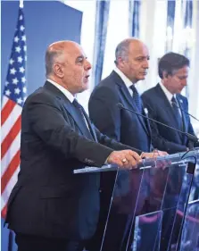  ?? ETIENNE LAURENT, EUROPEAN PRESSPHOTO AGENCY ?? From left, Haider al-Abadi of Iraq, Laurent Fabius of France and Tony Blinken of the United States speak in Paris.