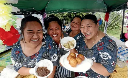 ?? MARTIN DE RUYTER/NELSON MAIL ?? Nuria Lefale, left, Matalena Ifopo, Rosalia Vitaoa and Poia Banse were all smiles at their Samoan food stall.