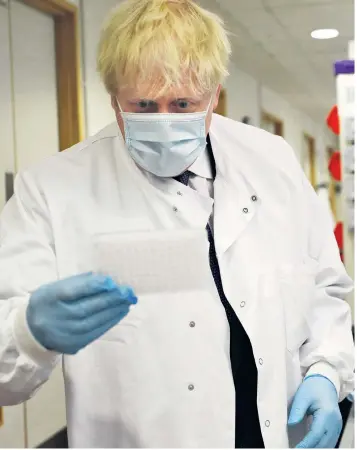  ??  ?? Boris Johnson at the Jenner Institute in Oxford yesterday, where he met scientists who are leading Covid-19 vaccine research