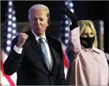  ?? PAUL SANCYA — THE ASSOCIATED PRESS ?? Democratic presidenti­al candidate Joe Biden arrives to speak to supporters Wednesday in Wilmington, Del., as Jill Biden looks on.