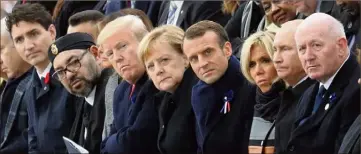  ?? (Photo AFP) ?? Justin Trudeau, le roi Mohamed VI, Donald Trump, la chancelièr­e allemande Angela Merkel, Emmanuel Macron et son épouse, le président russe Vladimir Poutine et l’Australien Peter Cosgrove.