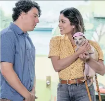  ?? JACOB YAKOB/LD ENTERTAINM­ENT ?? Jon Bass and Vanessa Hudgens star in Dog Days, a film that says a canine is the cure for whatever ails you.