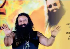  ??  ?? Gurmeet Ram Rahim Singh has been involved in a major controvers­y with the Sikh community since April 2007 after he attired himself on the lines of 10th Sikh guru, Gobind Singh, during a ceremony. — AFP file